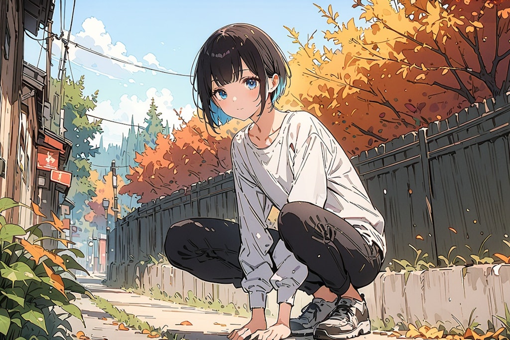 A young man sitting and resting in an alley where autumn has come