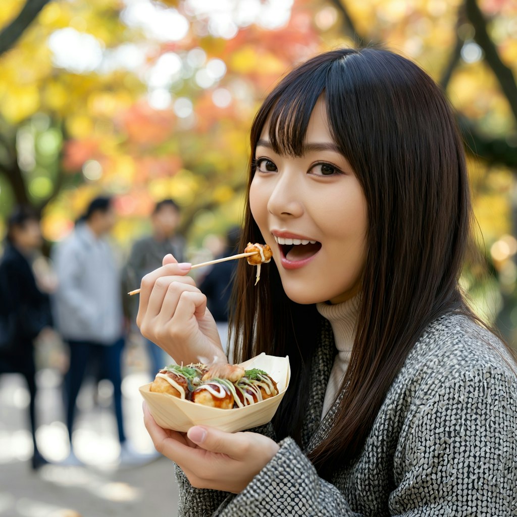 たこ焼きを食べる女性