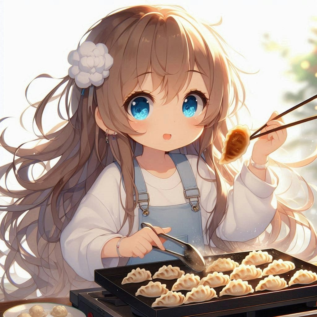 焼きたての餃子を食べる小さな女の子