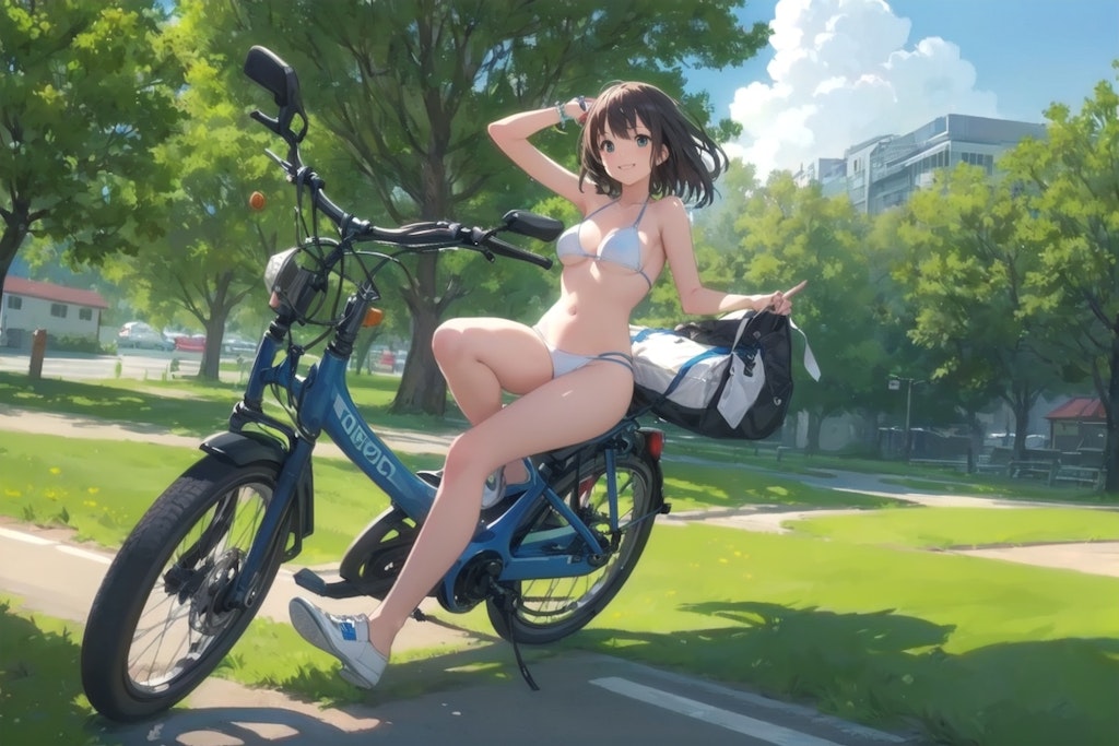 自転車にまたがるビキニのお姉さん